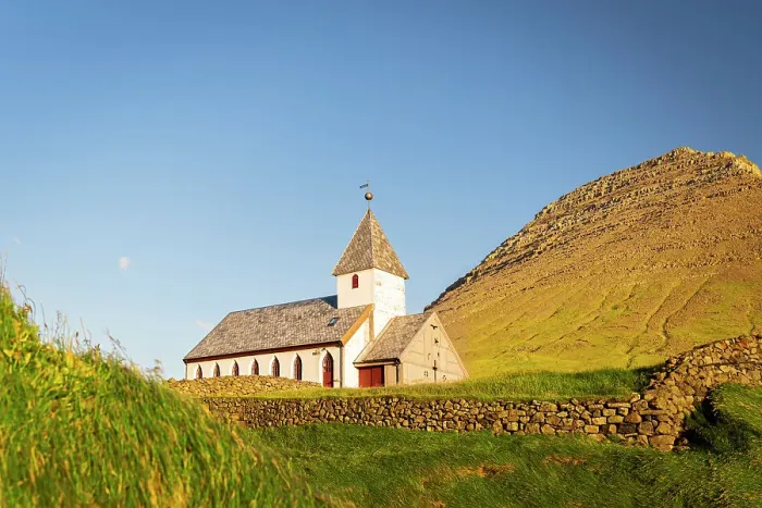 Framed Print : Traditional church facing the ocean at sunset, Vidareidi, Vidoy island, Faroe islands, Denmark Framed Print : Traditional church facing the ocean at sunset, Vidareidi, Vidoy island, Faroe islands, Denmark