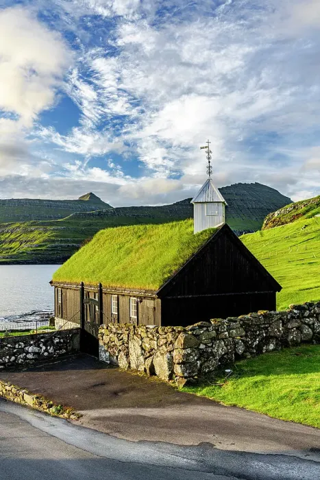 Framed Print : Traditional church with grass roof overlooking the fjord, Funningur, Eysturoy Island, Faroe Islands Framed Print : Traditional church with grass roof overlooking the fjord, Funningur, Eysturoy Island, Faroe Islands