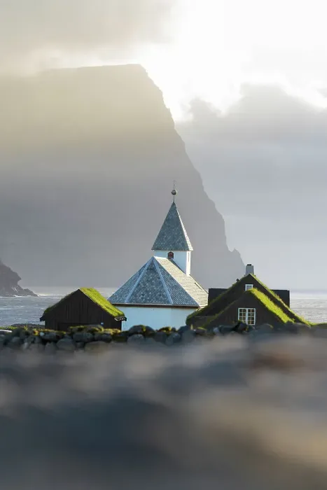 Framed Print : Traditional church and houses with grass roof in the village of Vidareidi at sunset, Vidoy island, Faroe islands, Denmark Framed Print : Traditional church and houses with grass roof in the village of Vidareidi at sunset, Vidoy island, Faroe islands, Denmark