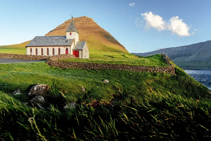 Framed Print : Traditional church of Vidareidi overlooking the ocean at sunset, Vidoy Island, Faroe Islands Framed Print : Traditional church of Vidareidi overlooking the ocean at sunset, Vidoy Island, Faroe Islands