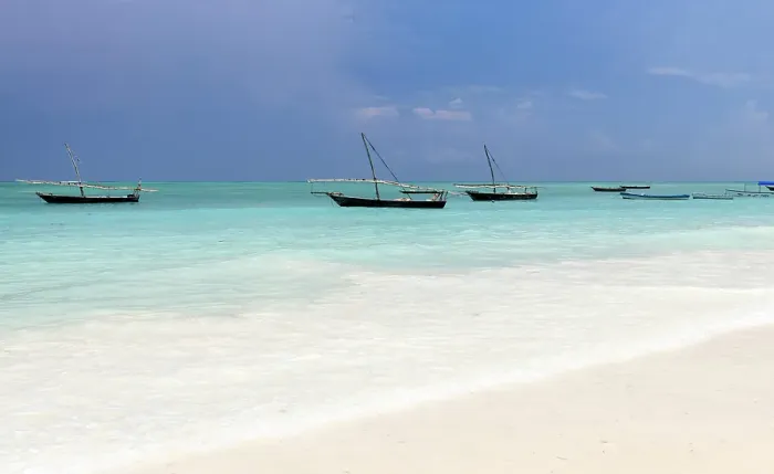 Framed Print : Traditional dhows moored in shallow sea near the beach, Nungwi, Zanzibar, Tanzania Framed Print : Traditional dhows moored in shallow sea near the beach, Nungwi, Zanzibar, Tanzania