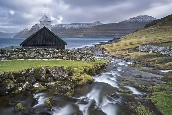Traditional Faroese wooden turf roofed church in the village of Funningur on the island of Eysturoy