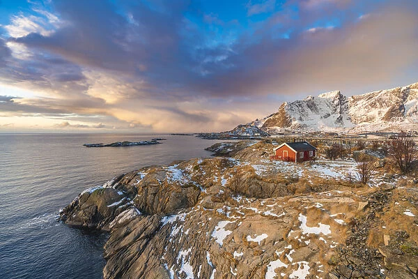 Traditional fishermen house in winter at dawn. Hamnoy, Nordland county, Northern Norway