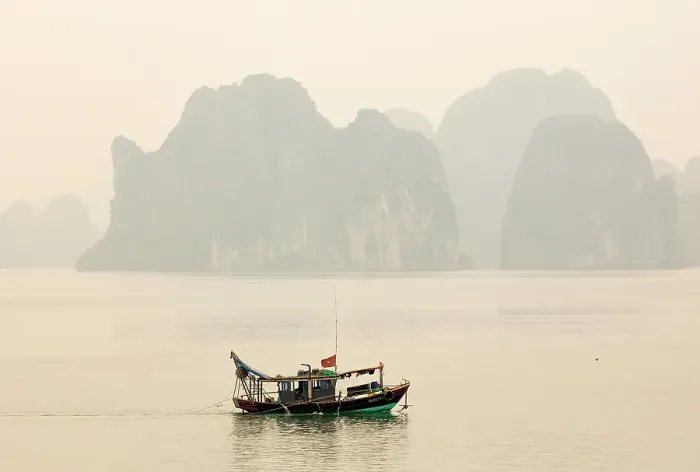 Framed Print : Traditional fishing boat and limestone islands at dawn, Halong Bay, Northeast Vietnam Framed Print : Traditional fishing boat and limestone islands at dawn, Halong Bay, Northeast Vietnam