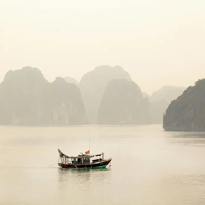 Framed Print : Traditional fishing boat and limestone islands at dawn, Halong Bay, Northeast Vietnam Framed Print : Traditional fishing boat and limestone islands at dawn, Halong Bay, Northeast Vietnam