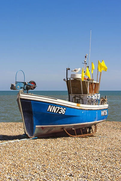 A traditional fishing boat on the shingle beach at Hastings, Sussex, England