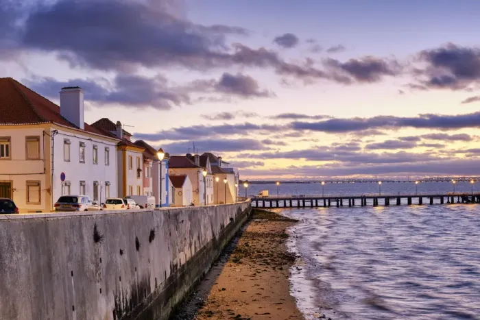 Framed Print : The traditional fishing village of Alcochete, spreading along the river Tagus