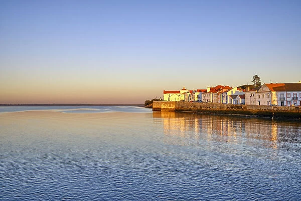The traditional fishing village of Alcochete at sunset, spreading along the river Tagus and facing Lisbon, on the other bank of the river. Portugal
