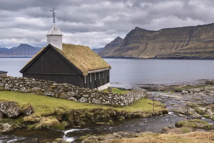Framed Print : Traditional grass roofed Faroese church in the village of Funningur on the island Framed Print : Traditional grass roofed Faroese church in the village of Funningur on the island