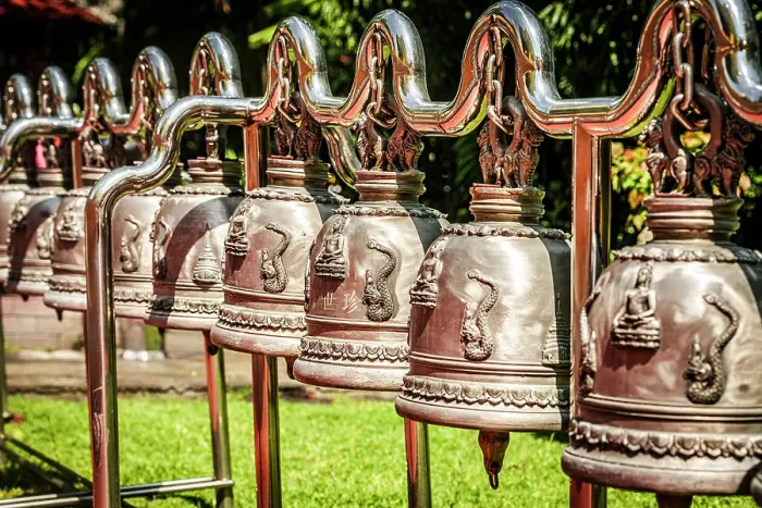 Framed Print : Traditional hanging brass prayers bells in a row in a buddhist temple, Thailand Framed Print : Traditional hanging brass prayers bells in a row in a buddhist temple, Thailand
