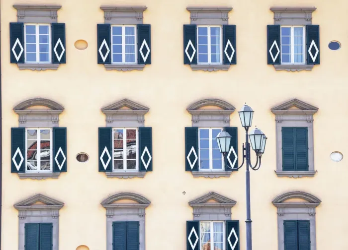 Framed Print : Traditional house decorated with Pisa symbol on the bank of Arno River, Pisa, Tuscany Framed Print : Traditional house decorated with Pisa symbol on the bank of Arno River, Pisa, Tuscany