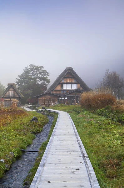 Traditional houses of Ogimachi (UNESCO World Heritage Site) in mist, Shirakawa-go