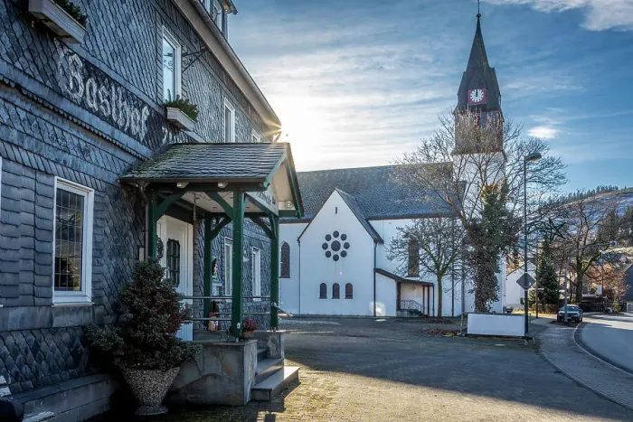 Framed Print : Traditional inn Hochheide and village church in Niedersfeld near Winterberg, Sauerland, North Rhine-Westphalia, Germany