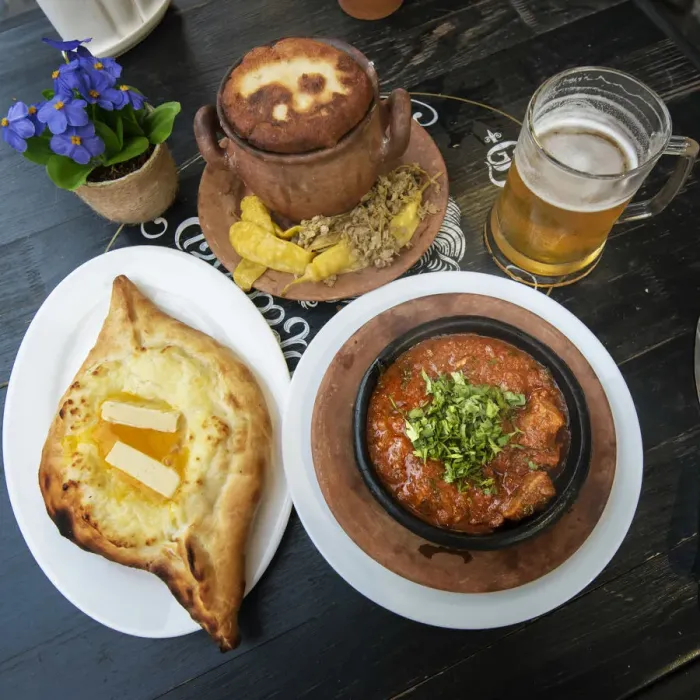 Framed Print : Traditional Lobio (stewed beans) in a ceramic pot and Adjaruli Khachapuri Framed Print : Traditional Lobio (stewed beans) in a ceramic pot and Adjaruli Khachapuri