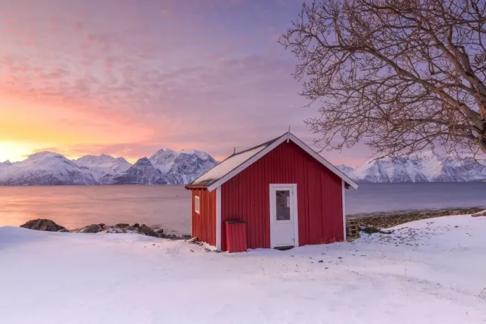Framed Print : Traditional Norwegian house during a sunset on the fjord. Nordmannvik, Kafjord, Lyngen Alps