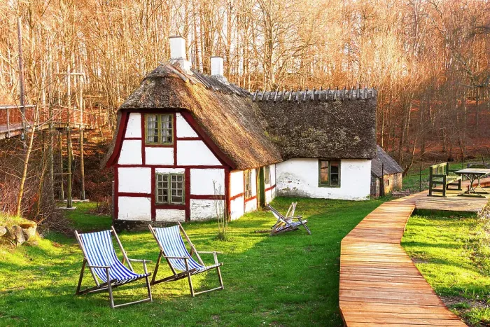 Framed Print : Traditional old danish farm house with thatched roof, green lawn and sun chairs in the zealand countryside, Zealand, Denmark, Europe Framed Print : Traditional old danish farm house with thatched roof, green lawn and sun chairs in the zealand countryside, Zealand, Denmark, Europe