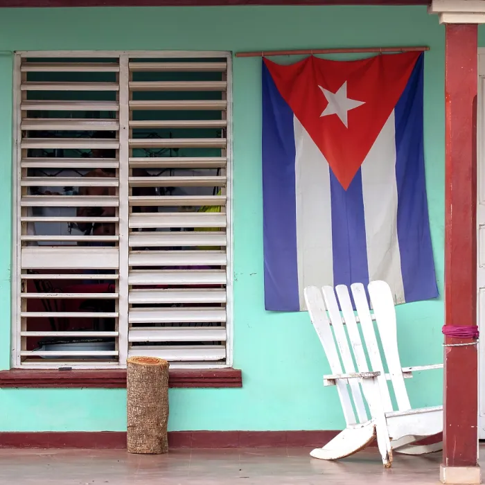 Framed Print : Traditional rocking chair and Cuban flag on the front porch of a house in Vinales, Pinar del Rio Province, Cuba Framed Print : Traditional rocking chair and Cuban flag on the front porch of a house in Vinales, Pinar del Rio Province, Cuba