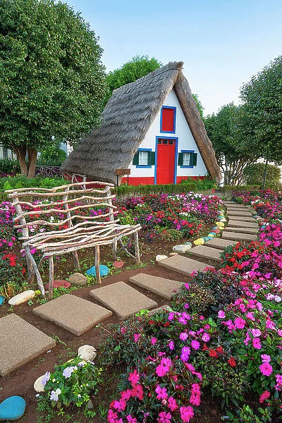 Traditional thatch house with flowers, Santana, Madeira, Portugal