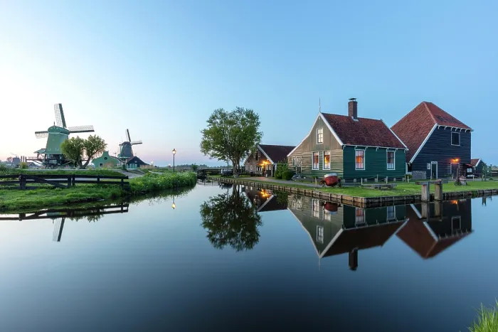 Framed Print : Traditional wooden houses reflected in a canal, Zaanse Schans, North Holland, Netherlands Framed Print : Traditional wooden houses reflected in a canal, Zaanse Schans, North Holland, Netherlands