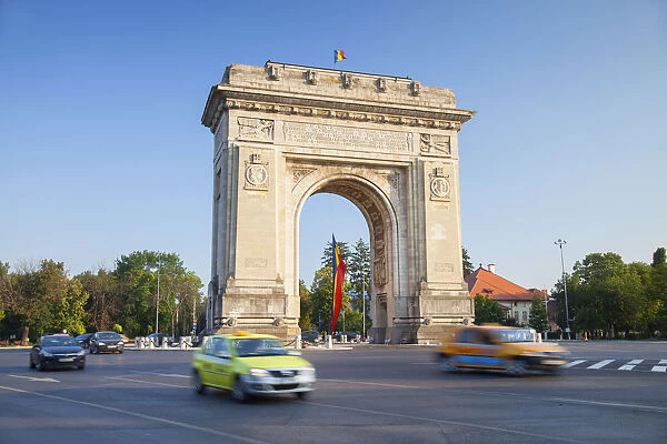 Traffic passing Arch of Triumph, Bucharest, Romania