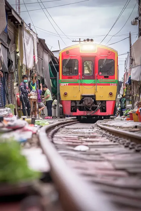 Framed Print : Train approaching at Mae Klong Railway market, Samut Songkhram province, Bangkok, Thailand