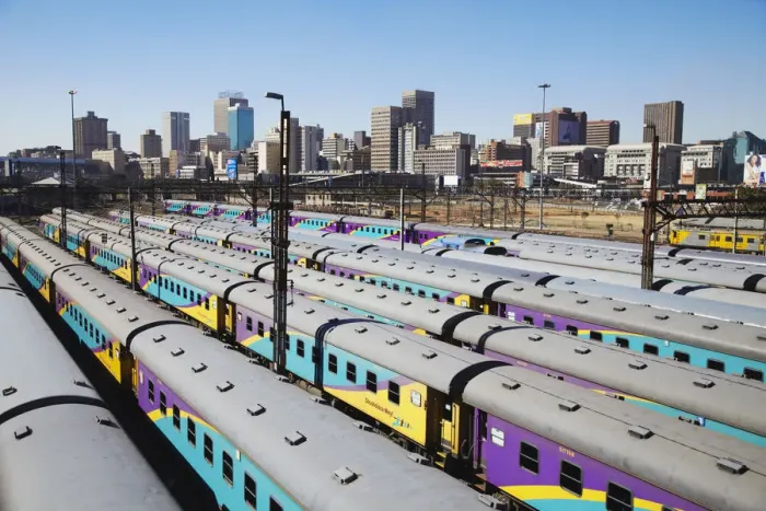 Framed Print : Train carriages at Park Station with city skyline in background, Johannesburg, Gauteng Framed Print : Train carriages at Park Station with city skyline in background, Johannesburg, Gauteng