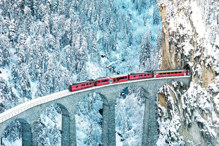 Framed Print : Train on Landwasser viaduct entering in a tunnel carved into a mountain ridge in winter, Filisur, Graubunden canton, Switzerland Framed Print : Train on Landwasser viaduct entering in a tunnel carved into a mountain ridge in winter, Filisur, Graubunden canton, Switzerland