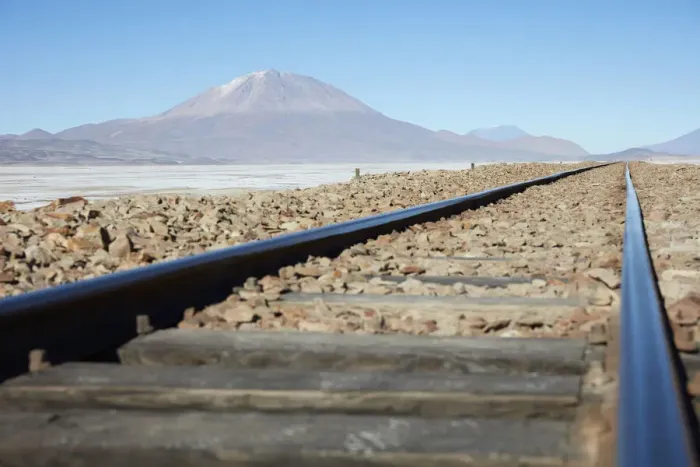 Framed Print : A train track on the Bolivian plateau with the OllagAoe volcano in the background Framed Print : A train track on the Bolivian plateau with the OllagAoe volcano in the background