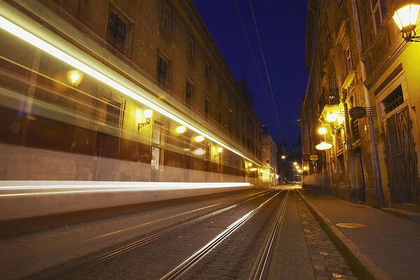 Tram passing along Ruska Street at dusk, Lviv, Ukraine