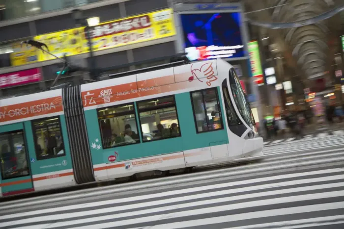 Framed Print : Tram passing along street, Hiroshima, Hiroshima Prefecture, Japan Framed Print : Tram passing along street, Hiroshima, Hiroshima Prefecture, Japan