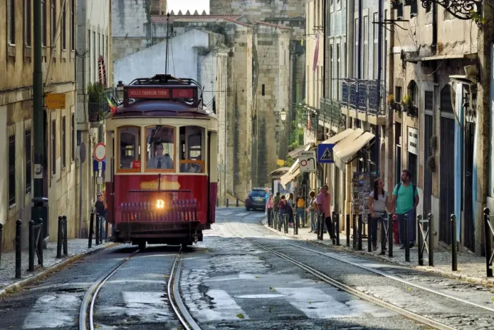 Framed Print : A tramway in Alfama district with the Motherchurch (Se Catedral) in the background Framed Print : A tramway in Alfama district with the Motherchurch (Se Catedral) in the background