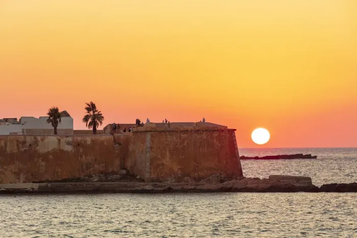 Framed Print : Trapani, Sicily. Seascape of the Ligny tower with the sun setting in the sea