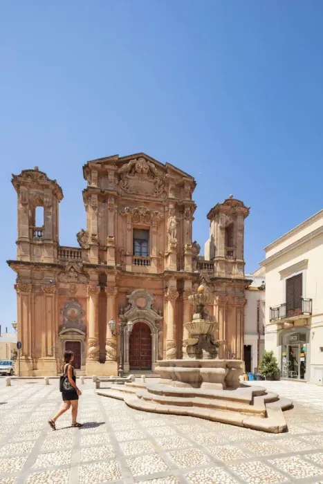 Framed Print : Trapani, Sicily. A woman walking in front of Purgatory Church in Marsala town center Framed Print : Trapani, Sicily. A woman walking in front of Purgatory Church in Marsala town center