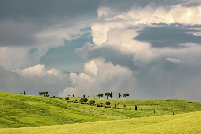Framed Print : Trees and rolling green fields beneath a stormy sky, Val d'Orcia, near San Quirico d'Orcia, Tuscany, Italy Framed Print : Trees and rolling green fields beneath a stormy sky, Val d'Orcia, near San Quirico d'Orcia, Tuscany, Italy