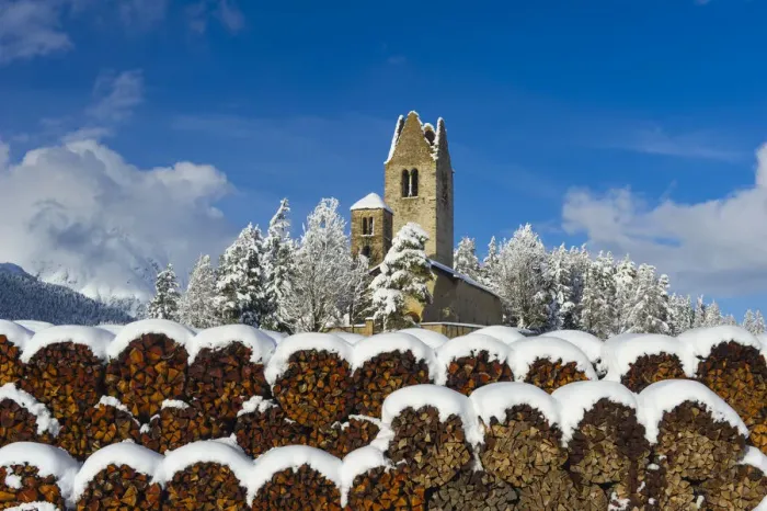 Framed Print : Trunks and old church in Celerina with pristine snow. Engadine, Switzerland, Europe Framed Print : Trunks and old church in Celerina with pristine snow. Engadine, Switzerland, Europe
