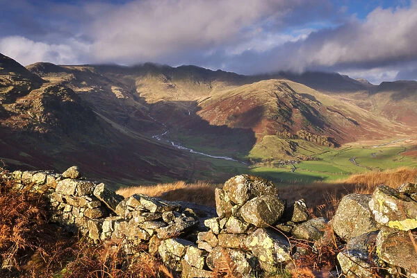 Tumbledown dry stone wall near Great Langdale in the Lake District, Cumbria, England