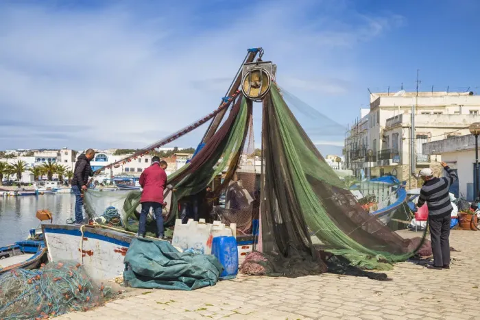 Framed Print : Tunisia, Bizerte, The Old Port, Fishermen examining nets Framed Print : Tunisia, Bizerte, The Old Port, Fishermen examining nets
