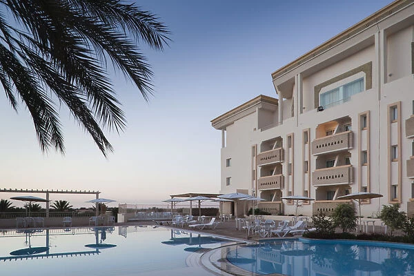 Tunisia, The Jerid Area, Tozeur, Hotel El Mouradi, swimming pool view, dawn