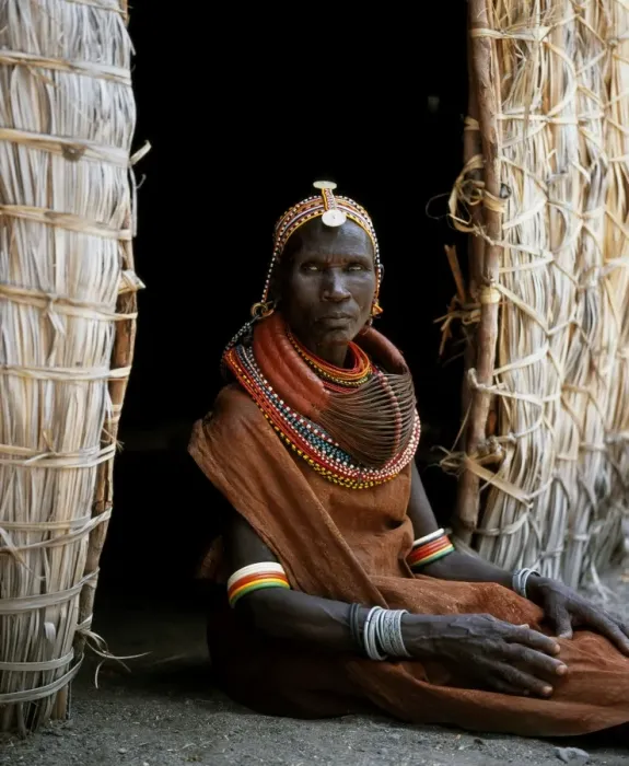 Framed Print : A Turkana woman sitting in the doorway of her hut
