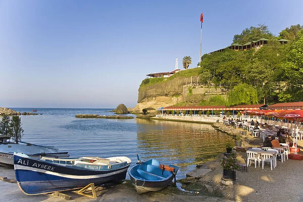 Turkey, Trabzon, Ocean front restaurant reflecting in Black sea