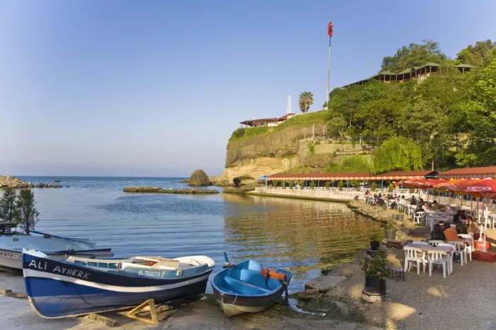 Framed Print : Turkey, Trabzon, Ocean front restaurant reflecting in Black sea