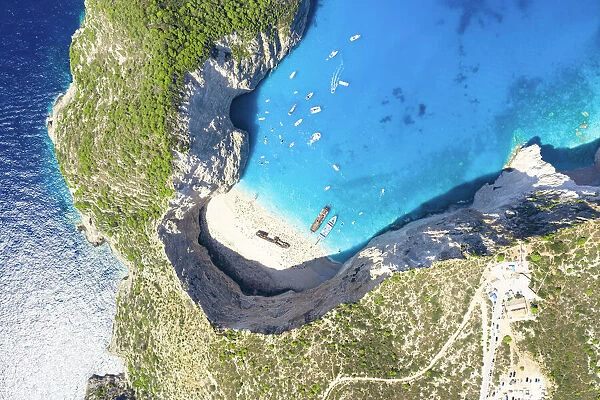 Turquoise lagoon surrounding the famous Shipwreck Beach (Navagio Beach) from above, aerial view, Zakynthos island, Greece