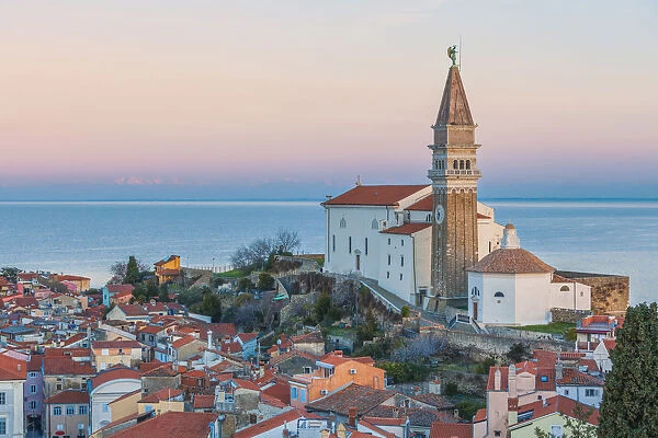 Twilight on the historic town of Piran with the church of St