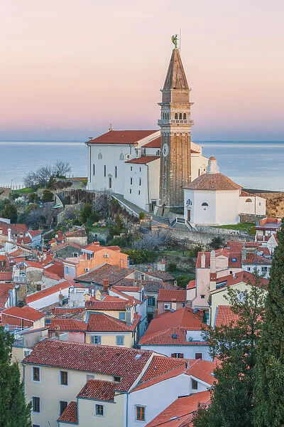 Twilight on the historic town of Piran with the church of St