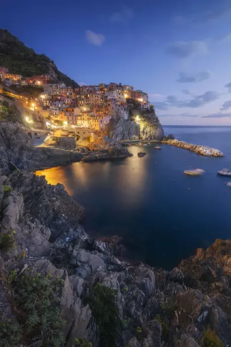 Framed Print : Twilight in Manarola, Cinque Terre, the most beautiful moment of the day when the lights of the town come Framed Print : Twilight in Manarola, Cinque Terre, the most beautiful moment of the day when the lights of the town come