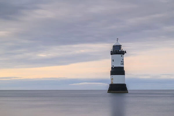 Twilight at Penmon Point Lighthouse on the coast of Anglesey, Wales, UK