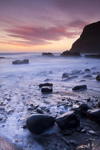 Twilight on the rocky beach at Duckpool on the North Cornish Coastline, Cornwall, England