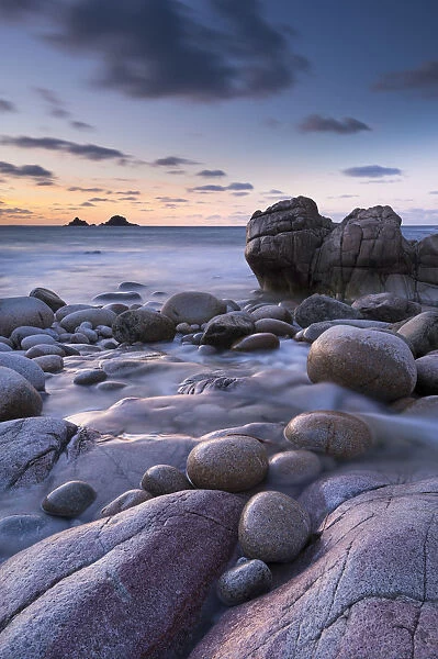 Twilight on the rocky Cornish cove at Porth Nanven, Cornwall, England. Winter (December)