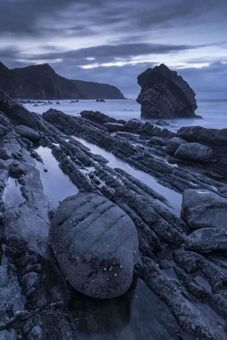 Framed Print : Twilight over the rocky shores of Mouthmill Beach on the North Devon coast, England Framed Print : Twilight over the rocky shores of Mouthmill Beach on the North Devon coast, England