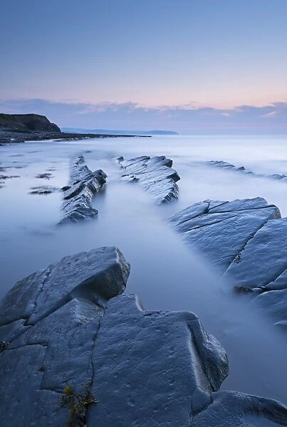 Twilight skies above rocky Kilve Beach on the Somerset Coast, England. Summer (July)